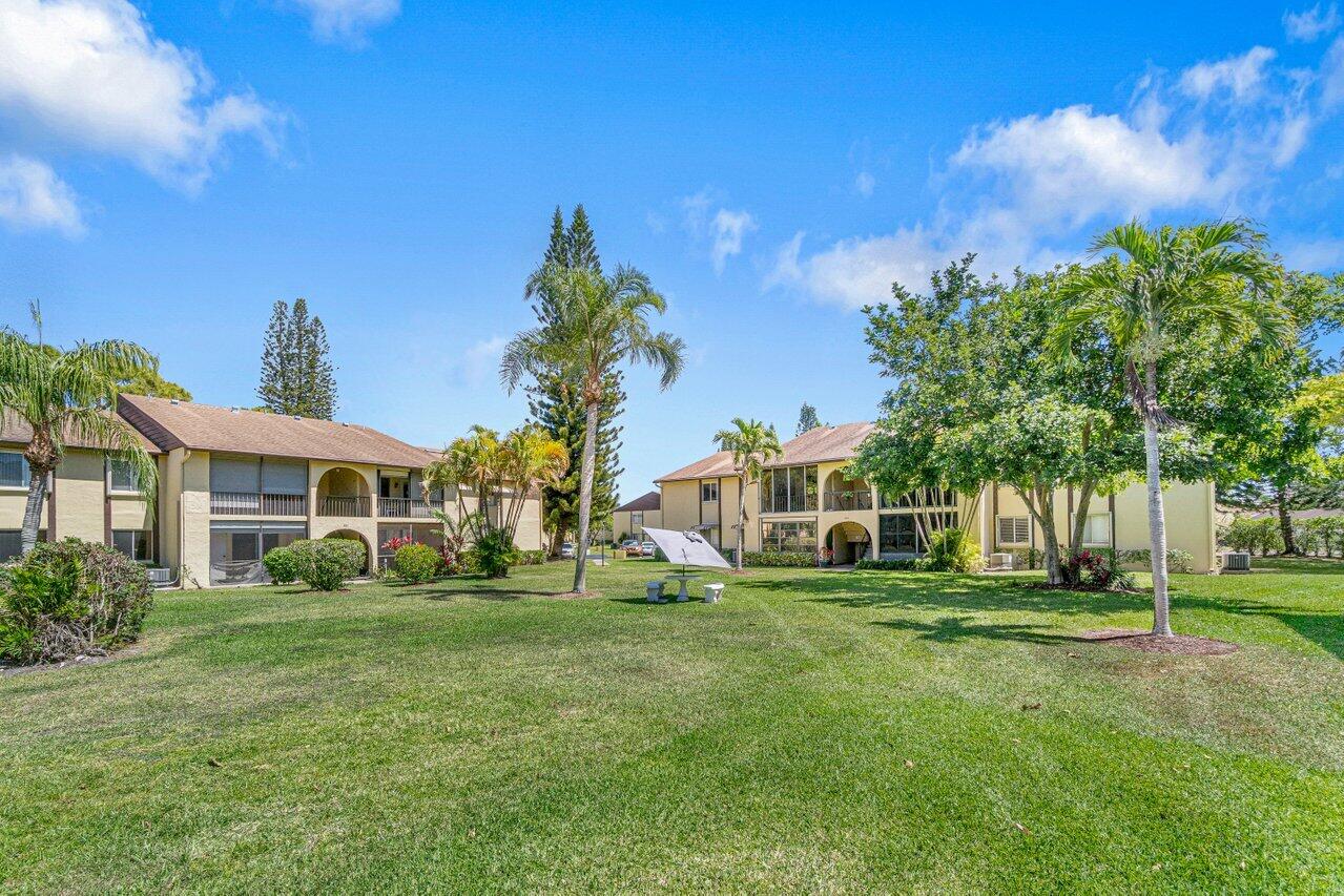 308 Pine Ridge Circle, Unit C2 Greenacres, FL 33463 - Photo 4 of 23 Grassy Area In Front Of Condo
