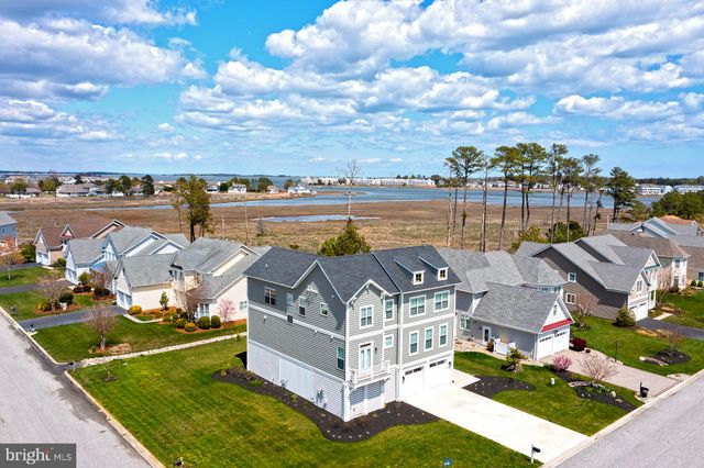 a view of a lake with a house in the background