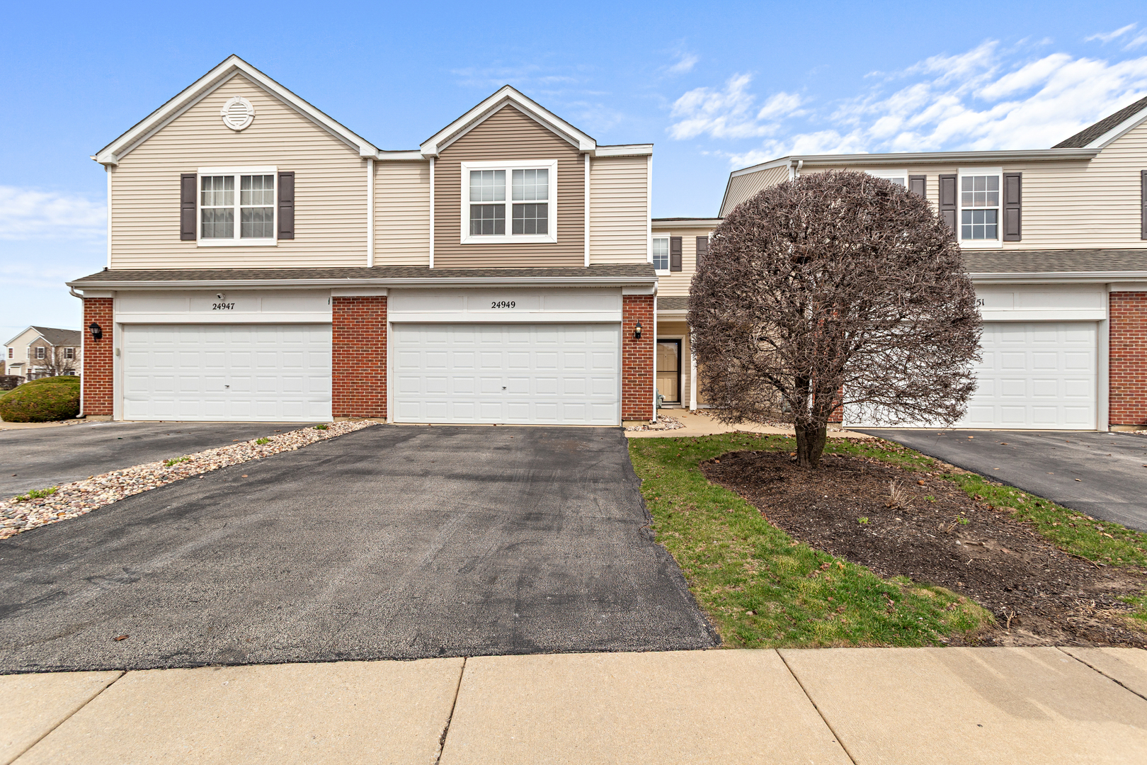 24949 Clare Circle Manhattan, IL 60442 - Photo 1 of 1 a view of a front of house with a yard