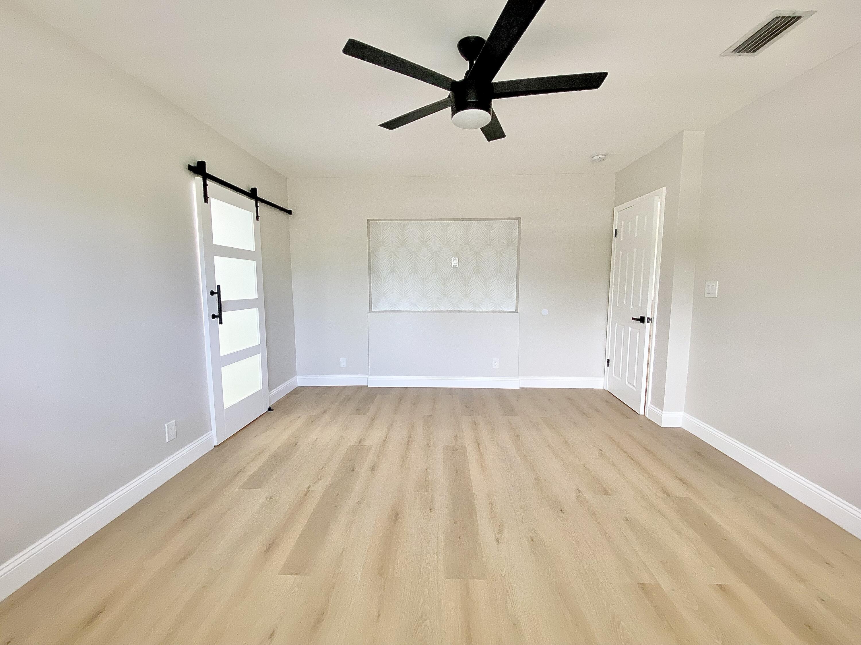 500 Southwest 3rd Avenue Boca Raton, FL 33432 - Photo 13 of 39 wooden floor in an empty room
