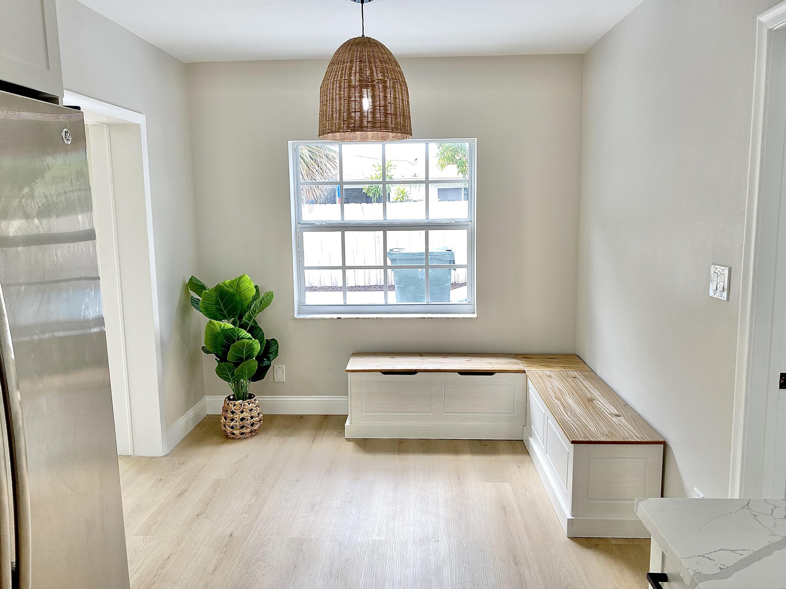 500 Southwest 3rd Avenue Boca Raton, FL 33432 - Photo 22 of 39 a view of an empty room and a window with wooden floor