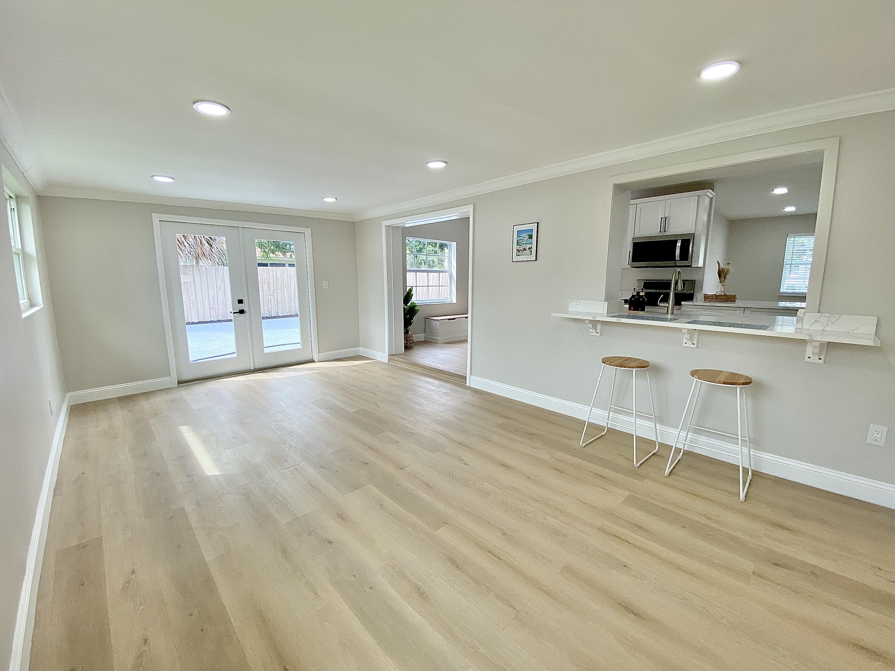 500 Southwest 3rd Avenue Boca Raton, FL 33432 - Photo 23 of 39 wooden floor in a kitchen with a table and chairs