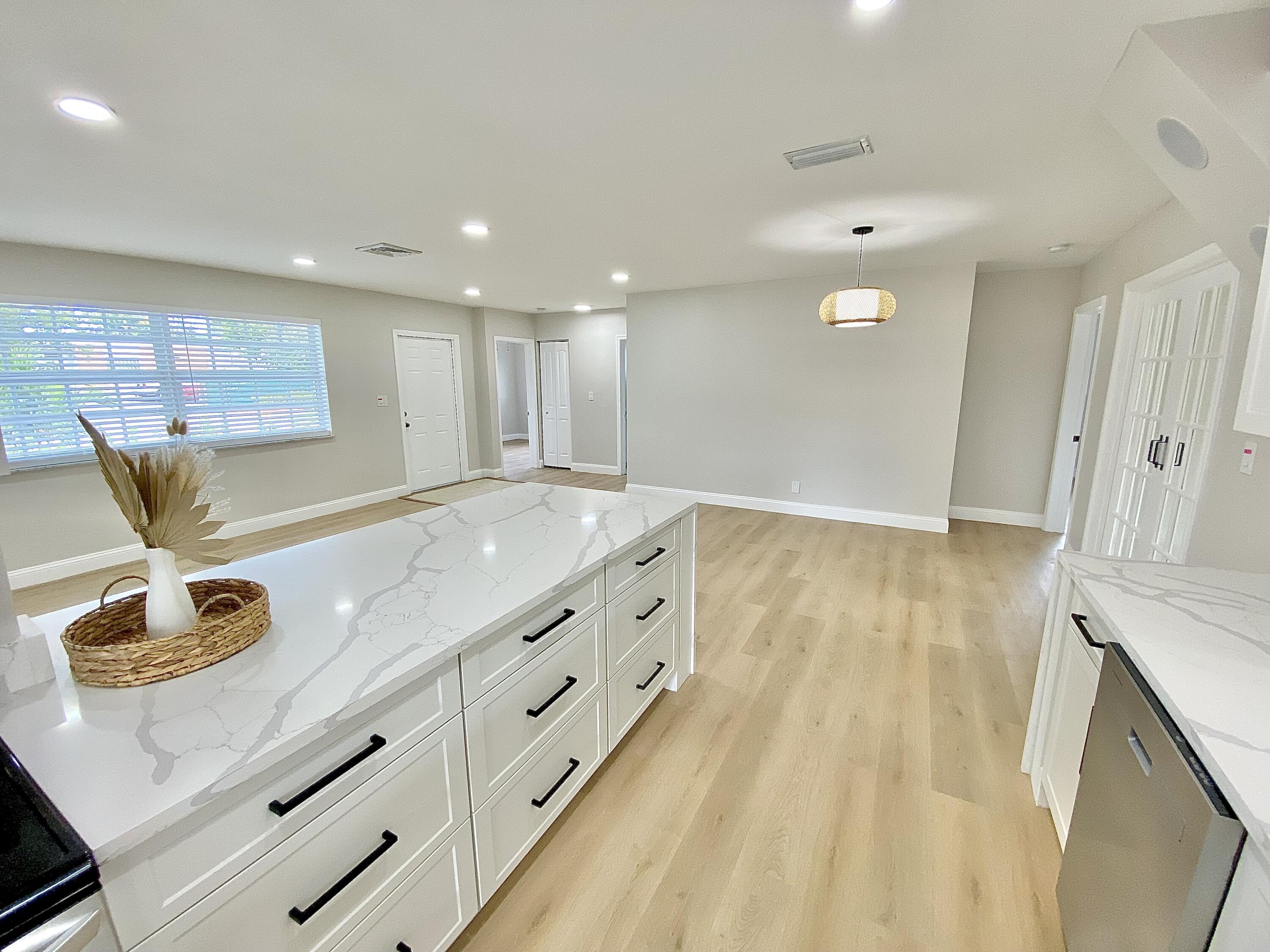 500 Southwest 3rd Avenue Boca Raton, FL 33432 - Photo 26 of 39 a view of kitchen cabinets and wooden floor