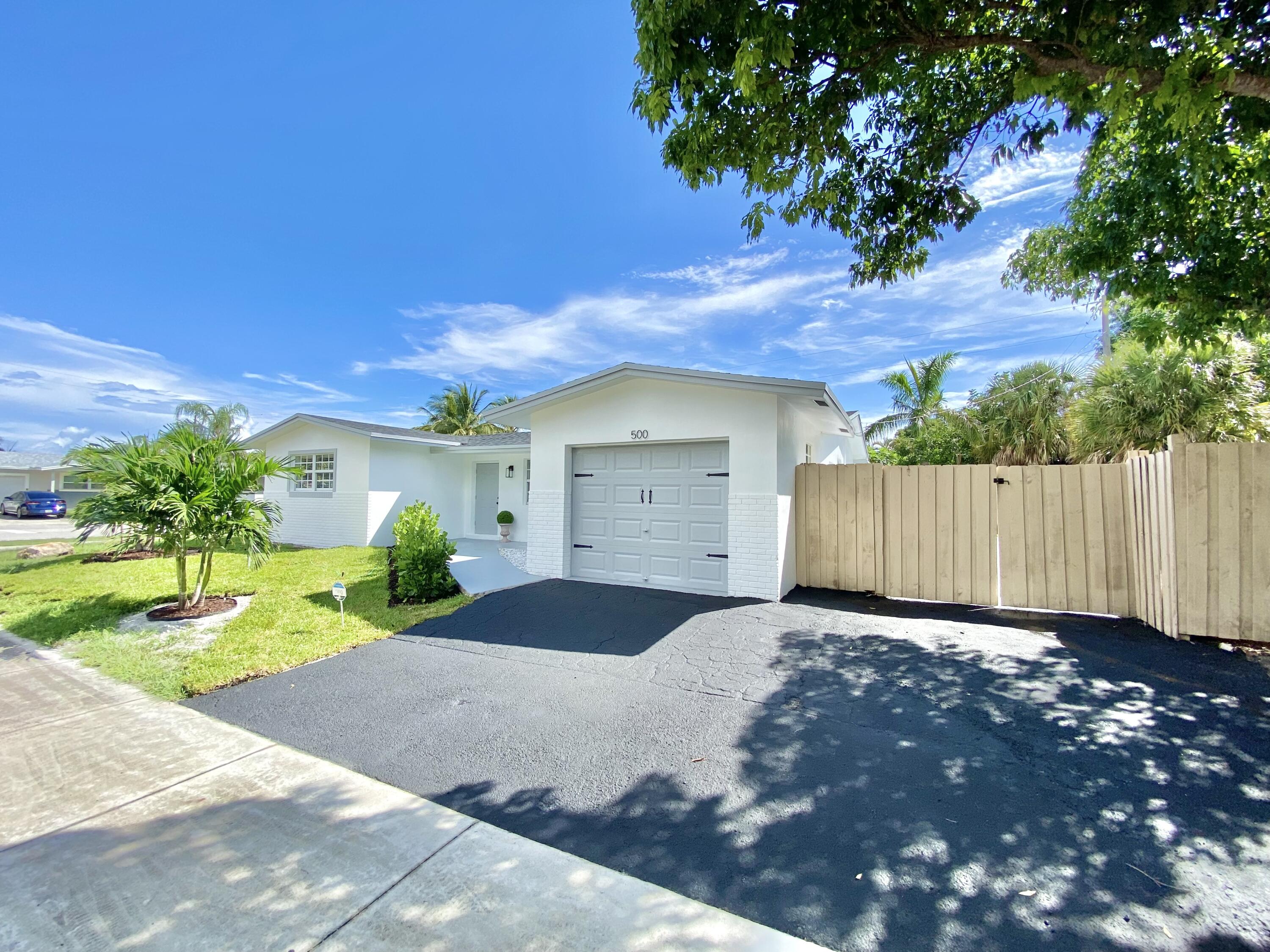 500 Southwest 3rd Avenue Boca Raton, FL 33432 - Photo 4 of 39 a view of a house with a yard and tree s