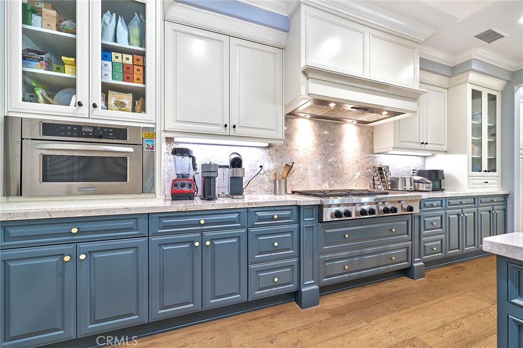 57 Statuary Irvine, CA 92620 - Photo 13 of 66 a kitchen with stainless steel appliances granite countertop a stove and cabinets