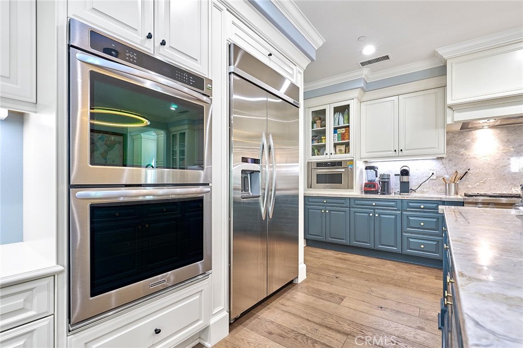 57 Statuary Irvine, CA 92620 - Photo 15 of 66 a kitchen with stainless steel appliances granite countertop a refrigerator and a stove