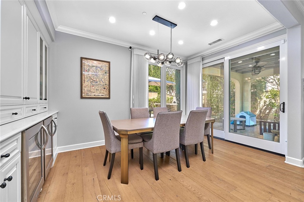 57 Statuary Irvine, CA 92620 - Photo 16 of 66 a view of a dining room with furniture window and wooden floor
