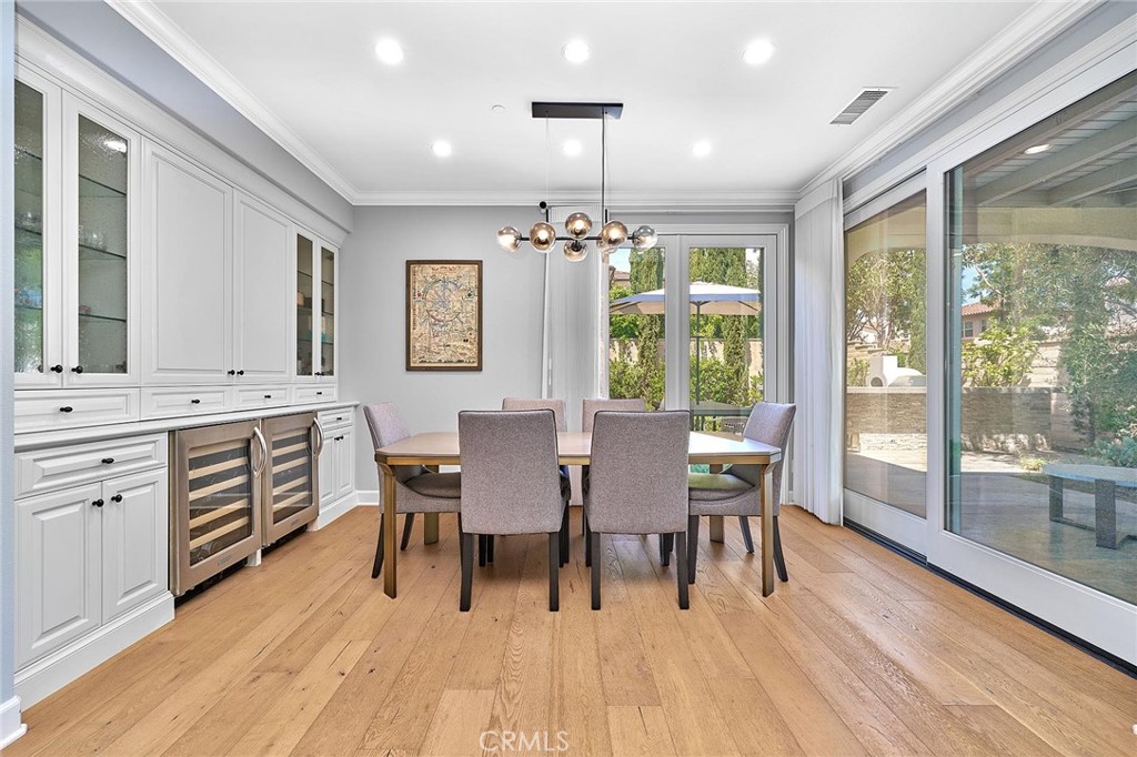 57 Statuary Irvine, CA 92620 - Photo 17 of 66 a view of a dining room with furniture window and wooden floor