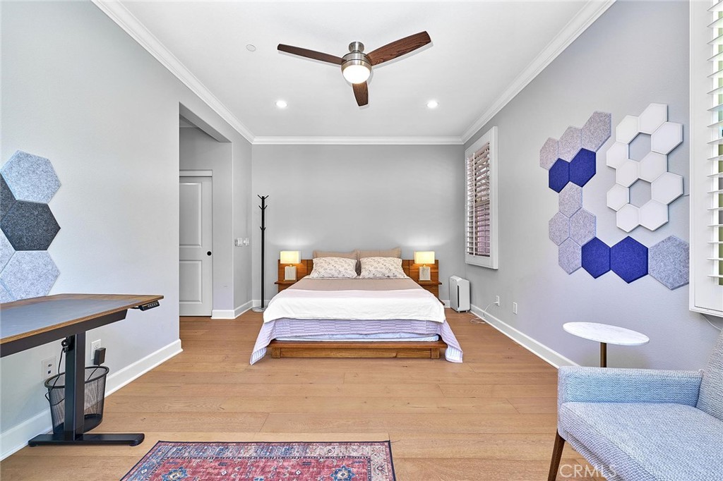 57 Statuary Irvine, CA 92620 - Photo 20 of 66 a spacious bedroom with a bed and a couch