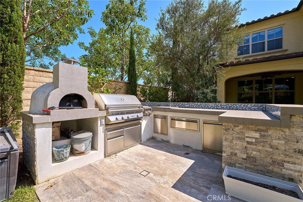 57 Statuary Irvine, CA 92620 - Photo 27 of 66 a view of a dinning area with furniture and fire pit