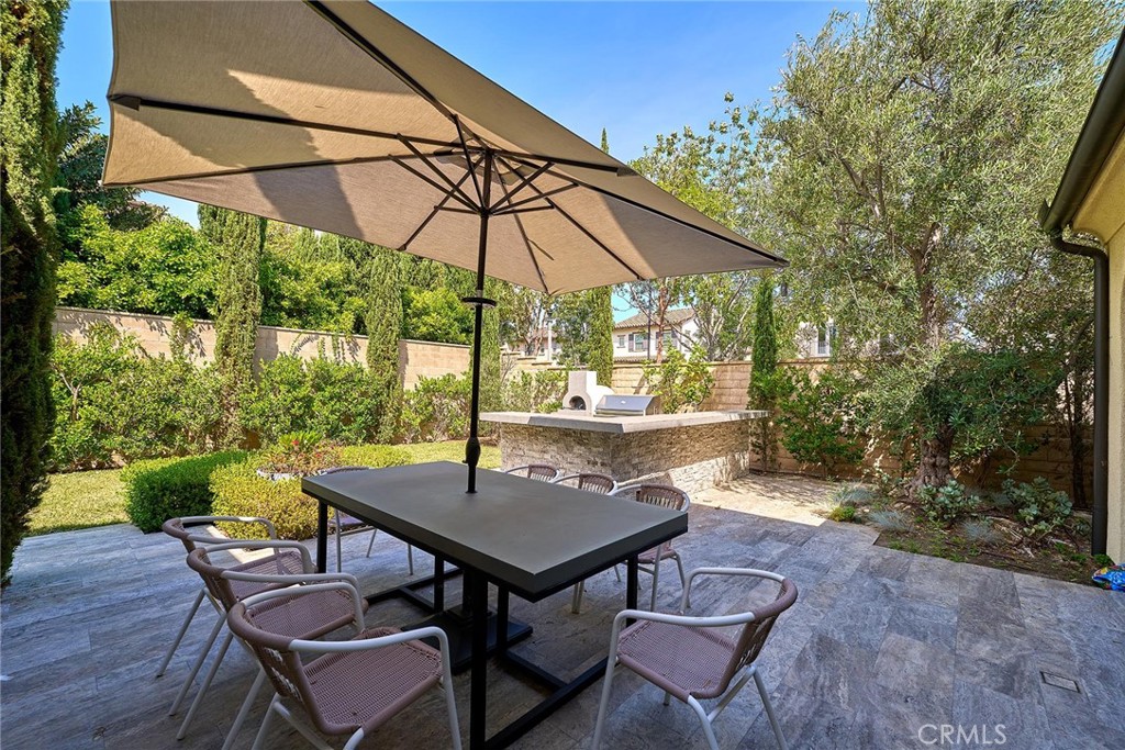 57 Statuary Irvine, CA 92620 - Photo 31 of 66 a backyard of a house with table and chairs