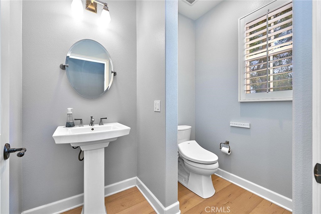 57 Statuary Irvine, CA 92620 - Photo 32 of 66 a bathroom with a sink a toilet and a mirror