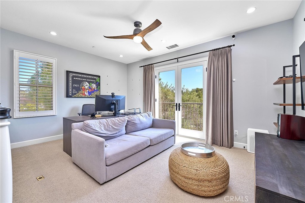 57 Statuary Irvine, CA 92620 - Photo 37 of 66 a living room with furniture and a large window