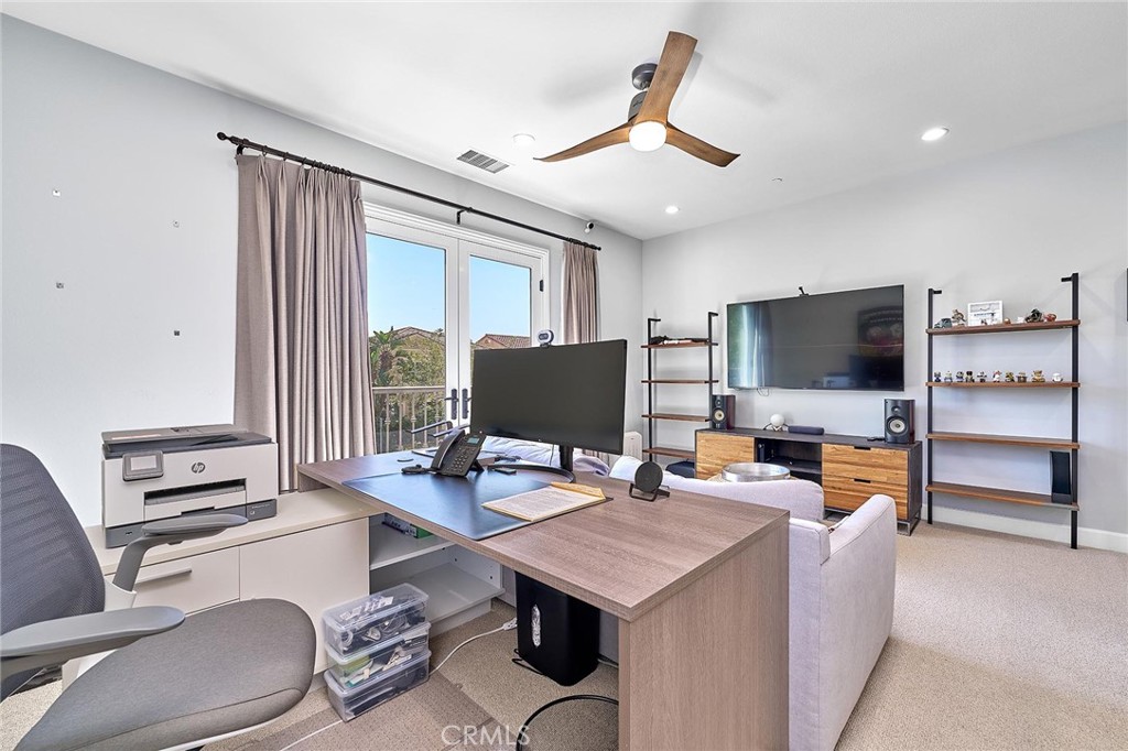 57 Statuary Irvine, CA 92620 - Photo 39 of 66 a living room with furniture and a flat screen tv