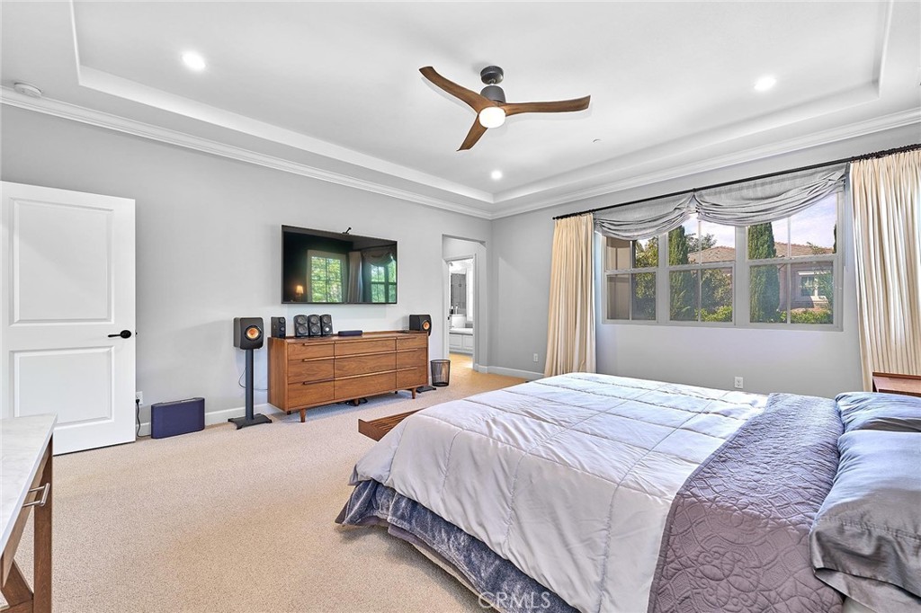 57 Statuary Irvine, CA 92620 - Photo 43 of 66 a bedroom with a bed a window and a flat screen tv
