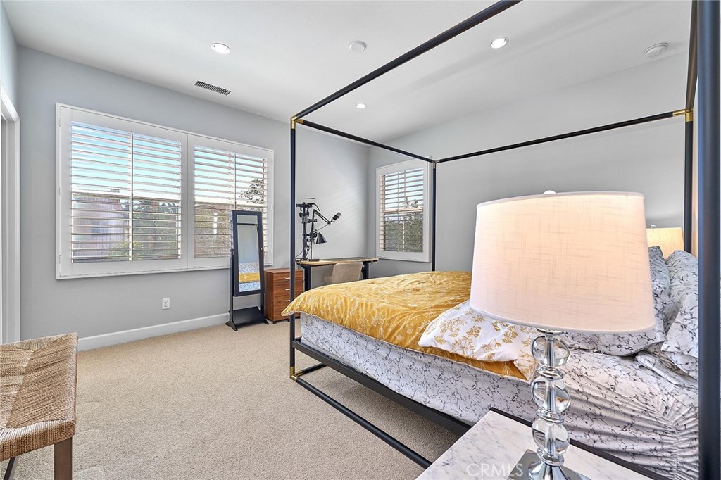 57 Statuary Irvine, CA 92620 - Photo 55 of 66 a bed sitting in a spacious bedroom next to a window