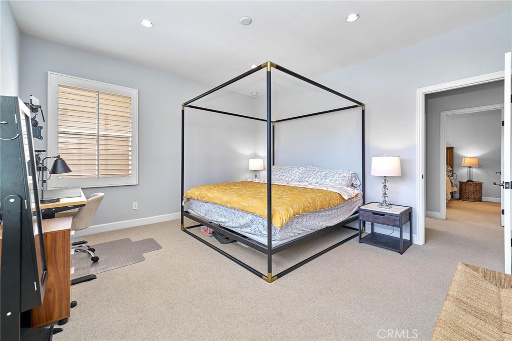 57 Statuary Irvine, CA 92620 - Photo 56 of 66 a spacious bedroom with a bed and window