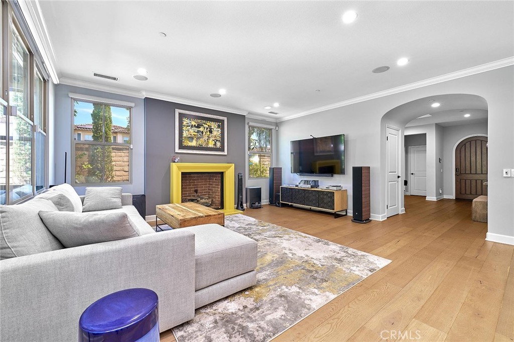 57 Statuary Irvine, CA 92620 - Photo 6 of 66 a living room with furniture flat screen tv and a fireplace