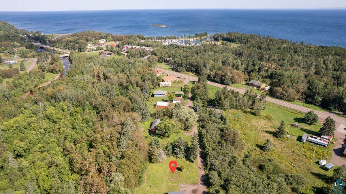 135 Coolidge Road Knife River, MN 55804 - Photo 3 of 6 Drone / aerial view featuring a water view