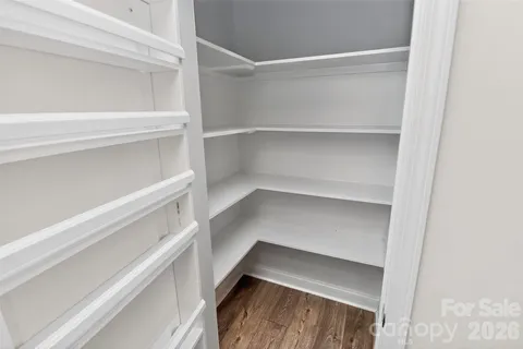 a view of an empty walk in closet