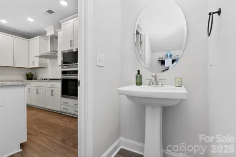 a kitchen with kitchen island a sink stainless steel appliances and cabinets