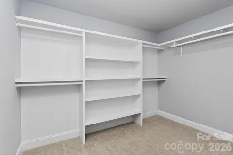 a view of an empty walk in closet