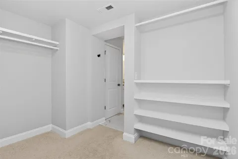 a view of an empty walk in closet