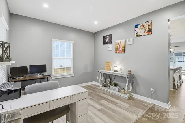 a work room with furniture and a window