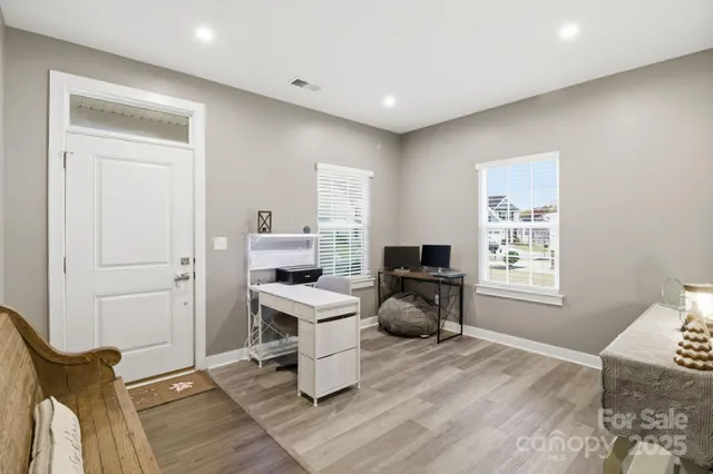 a workspace with furniture and a window