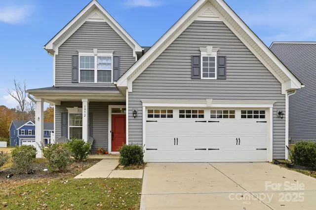 a view of house with yard