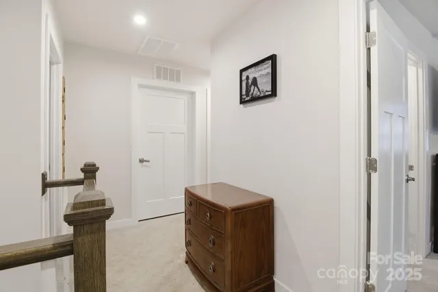 a view of a bedroom with furniture and windows