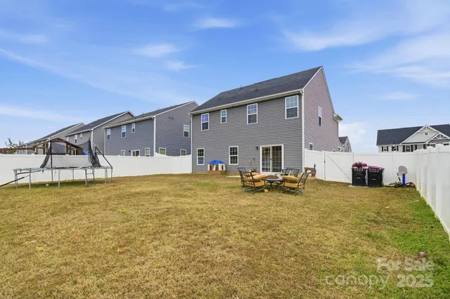 a swimming pool with an outdoor seating