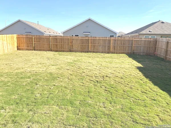a view of a back yard of the house