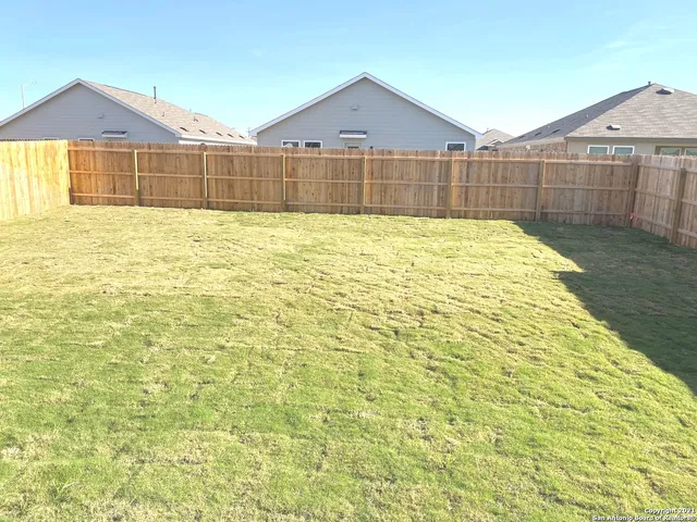 a view of a back yard of the house