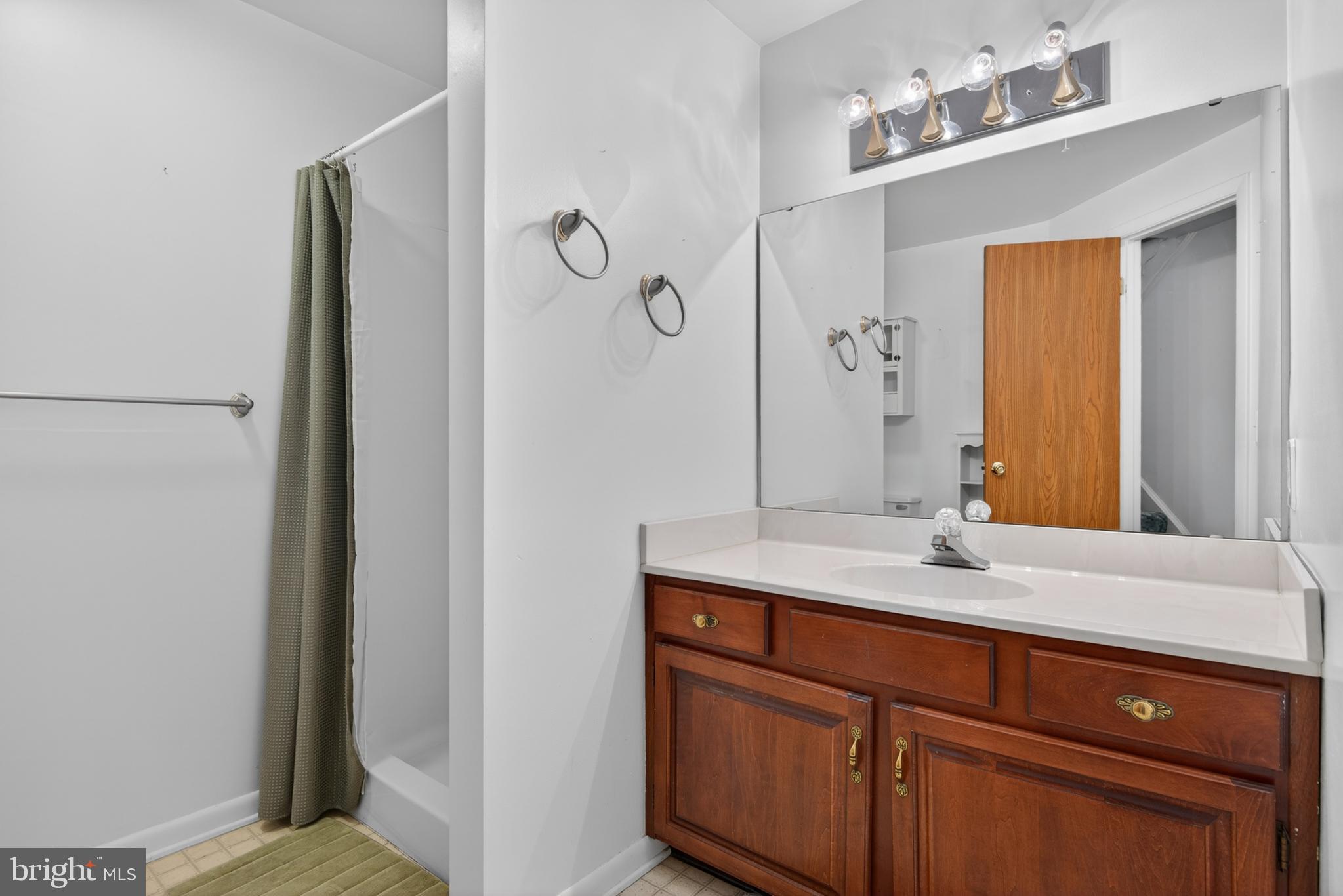 342 Larkin Drive Red Lion, PA 17356 - Photo 24 of 38 a bathroom with a granite countertop sink and a mirror