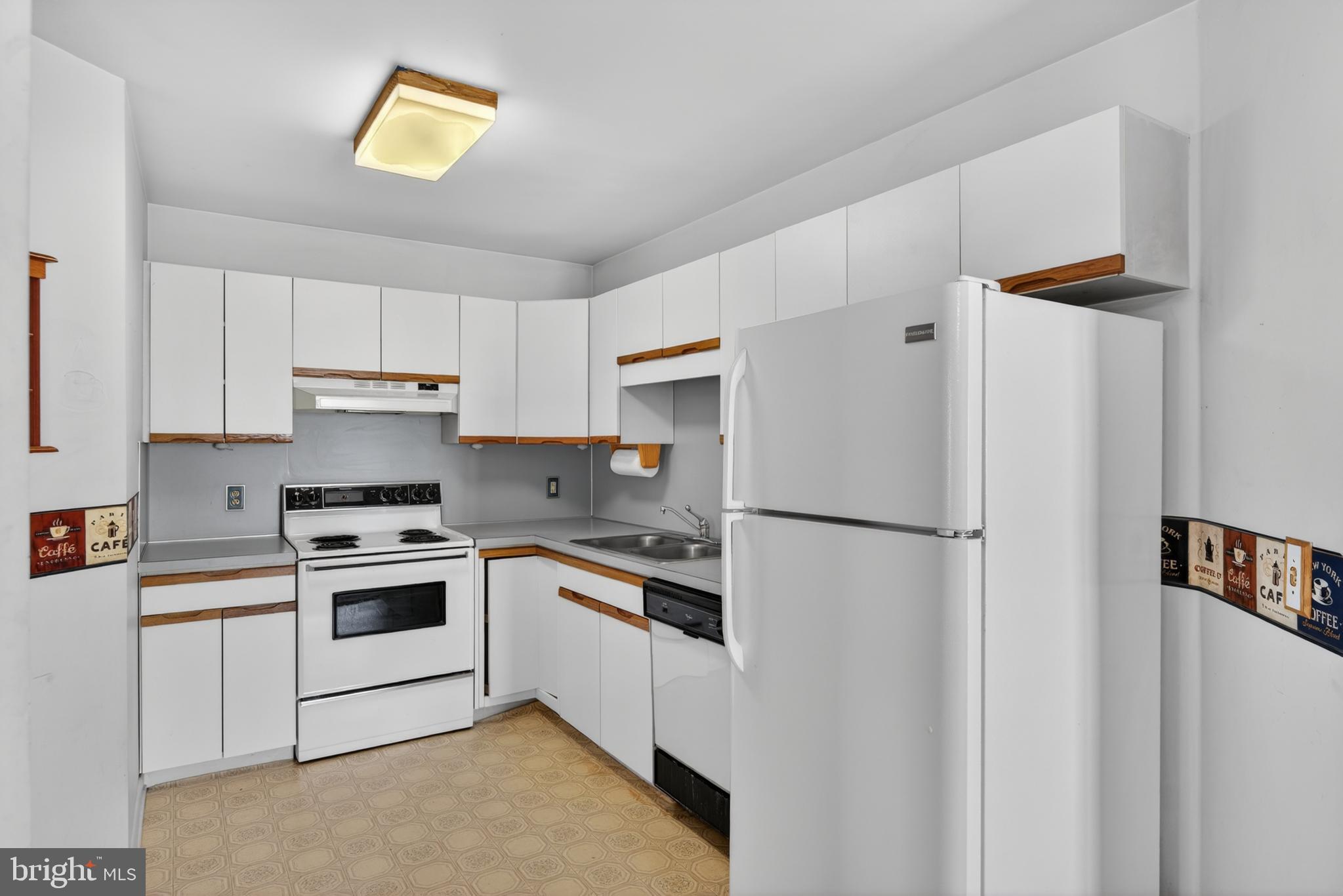 342 Larkin Drive Red Lion, PA 17356 - Photo 8 of 38 a kitchen with a white cabinets and white appliances
