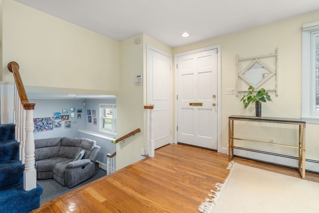 48 Gary Road Needham, MA 02494 - Photo 7 of 20 a bedroom with furniture and a potted plant