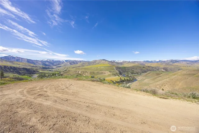 a view of an ocean and a mountain
