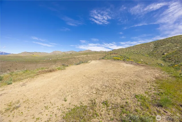 a view of an ocean from a mountain