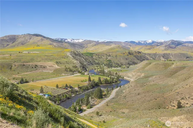 a view of an ocean and a mountain