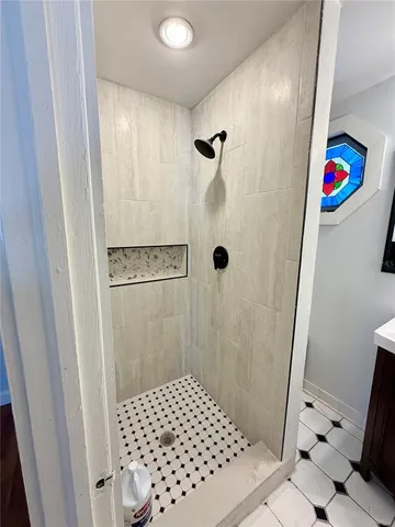 a bathroom with a sink and a shower