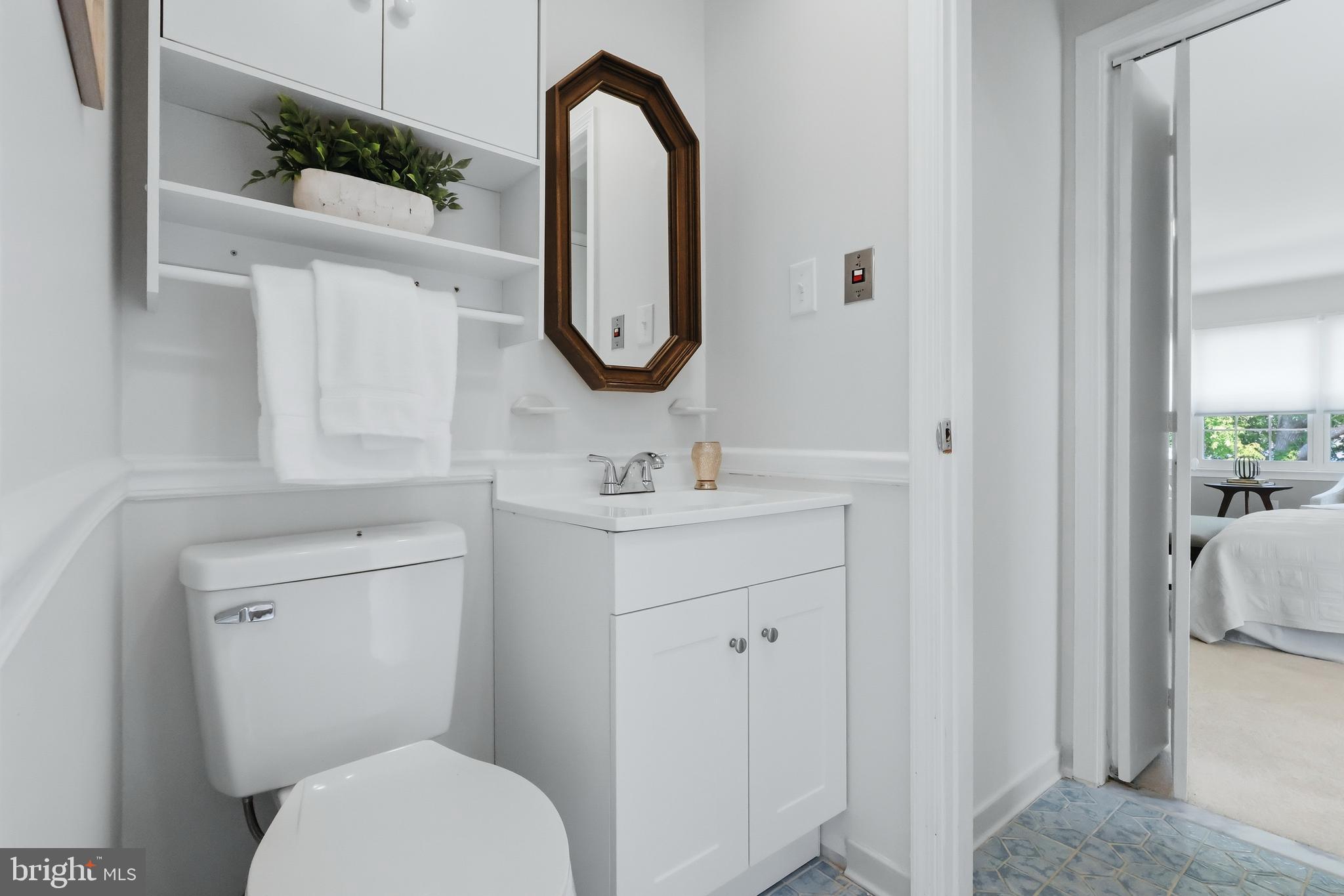 23500 River Road Lexington Park, MD 20653 - Photo 65 of 92 a bathroom with a toilet a sink and a mirror