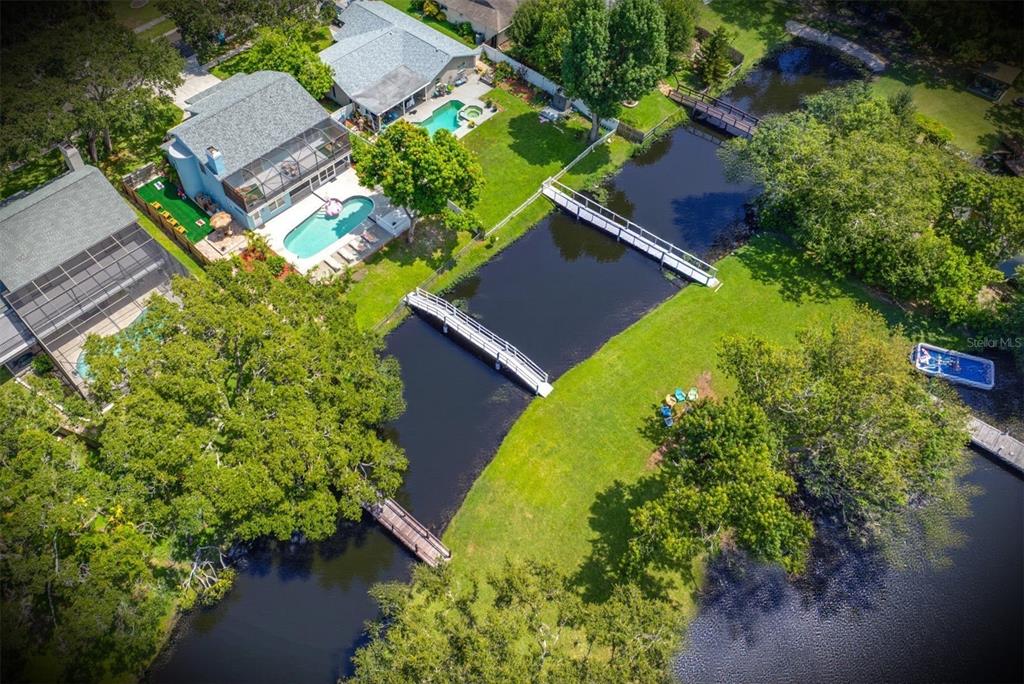 2153 Karan Way Clearwater, FL 33763 - Photo 3 of 65 an aerial view of a house with a yard and garden