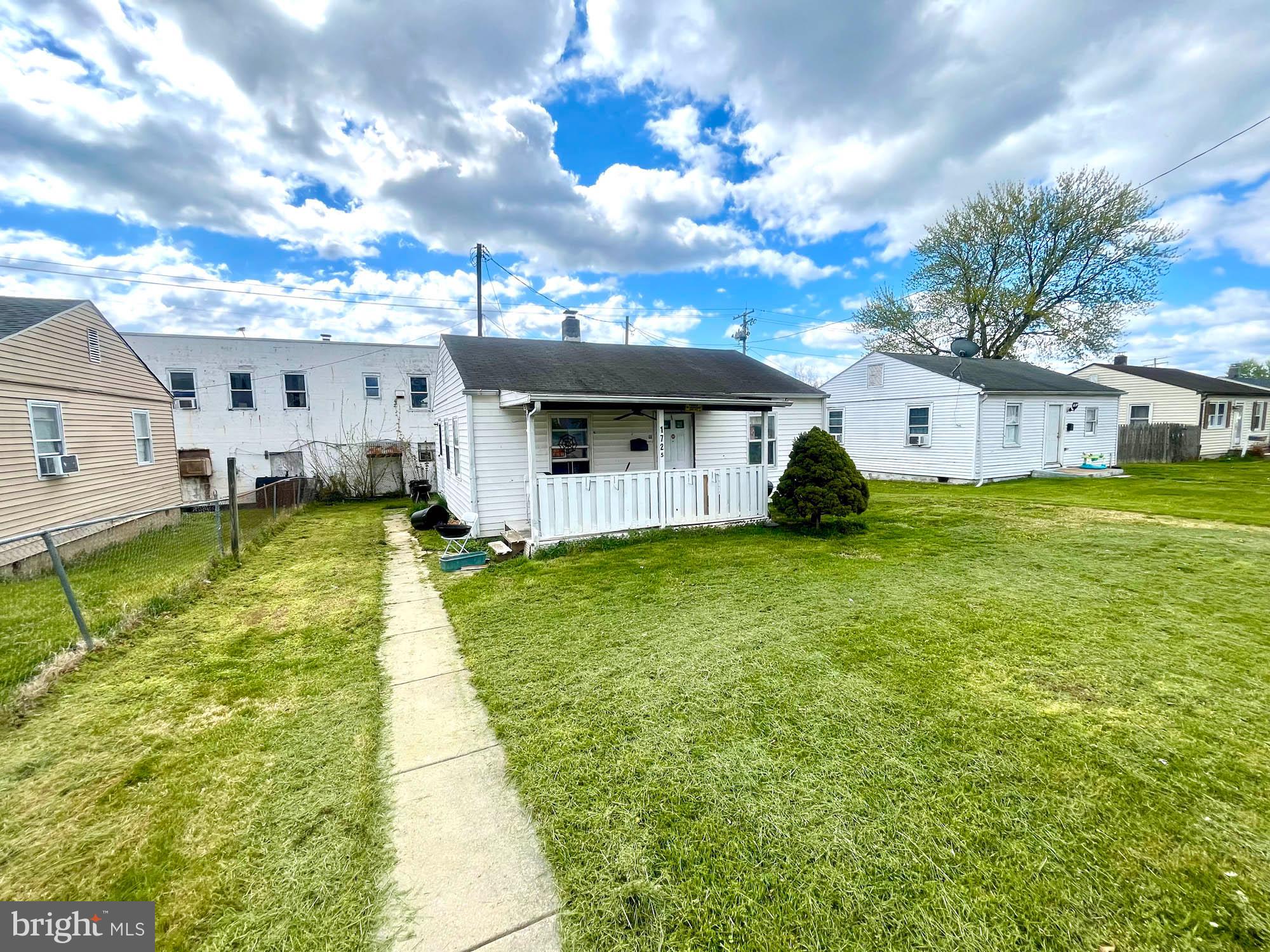 1727 Earhart Road Baltimore, MD 21221 - Photo 12 of 48 a view of a house with swimming pool and a yard