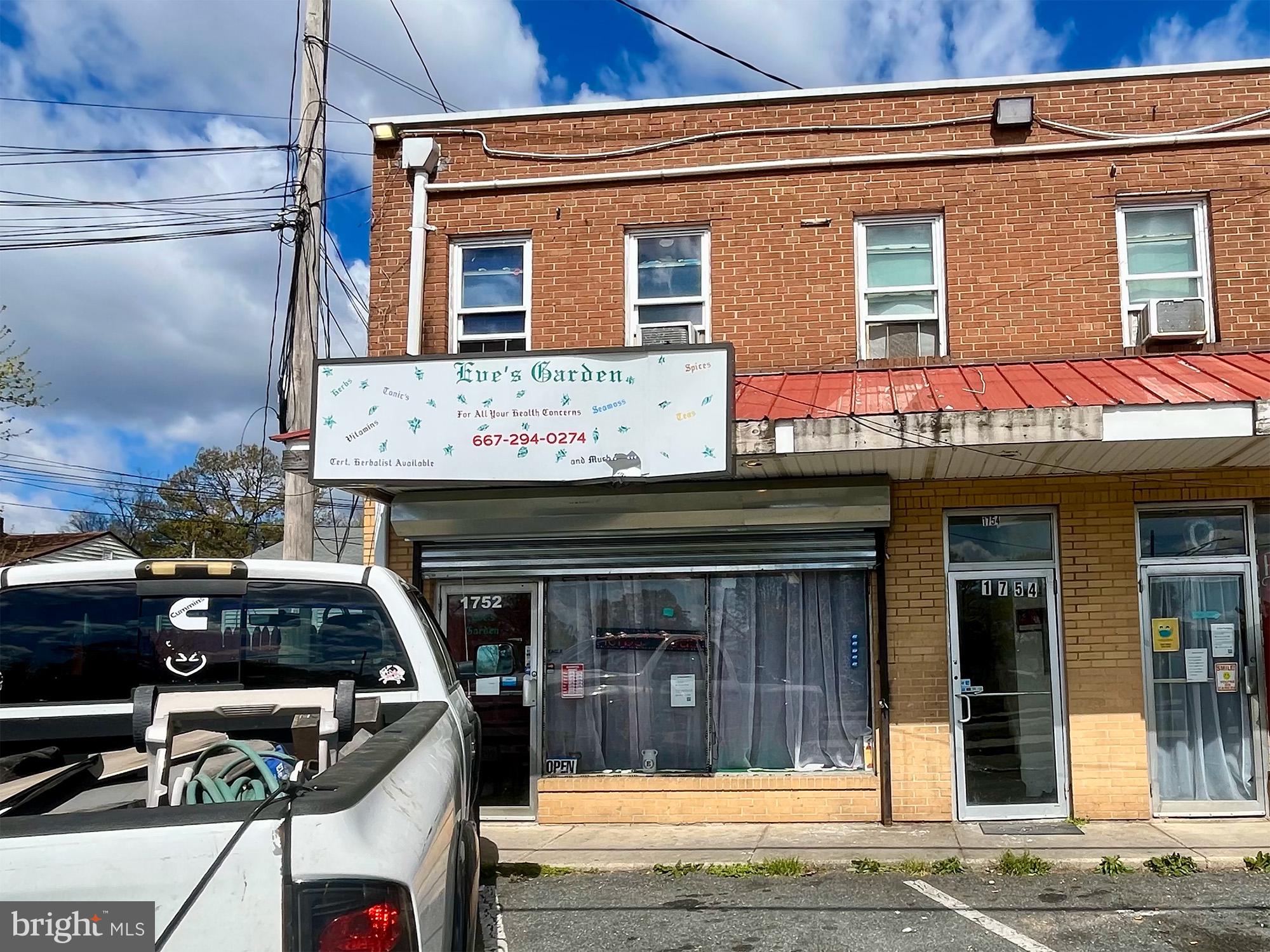 1727 Earhart Road Baltimore, MD 21221 - Photo 15 of 48 a front view of a house with parking