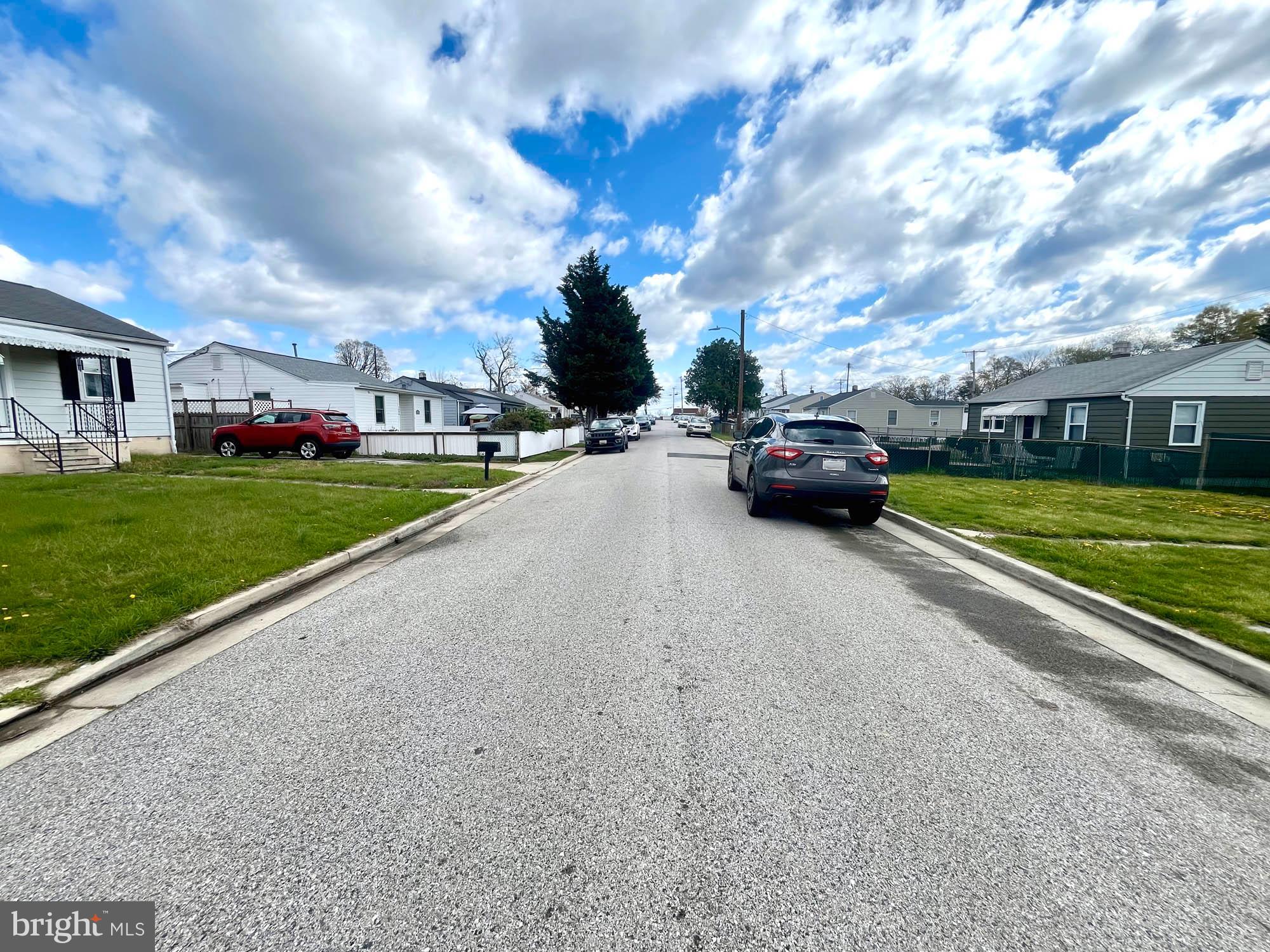 1727 Earhart Road Baltimore, MD 21221 - Photo 2 of 48 a view of street with parked cars