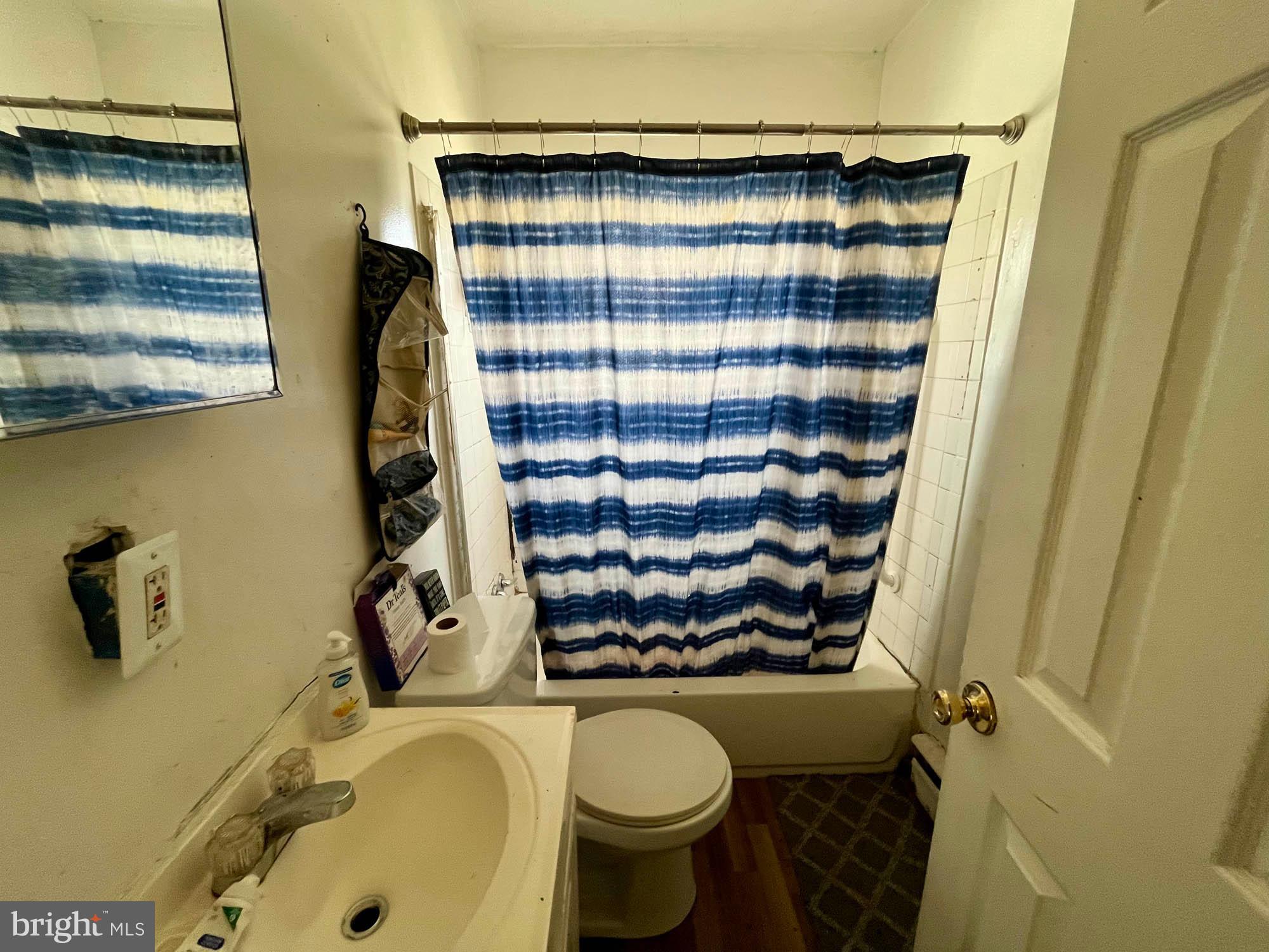 1727 Earhart Road Baltimore, MD 21221 - Photo 26 of 48 a bathroom with a sink toilet and shower