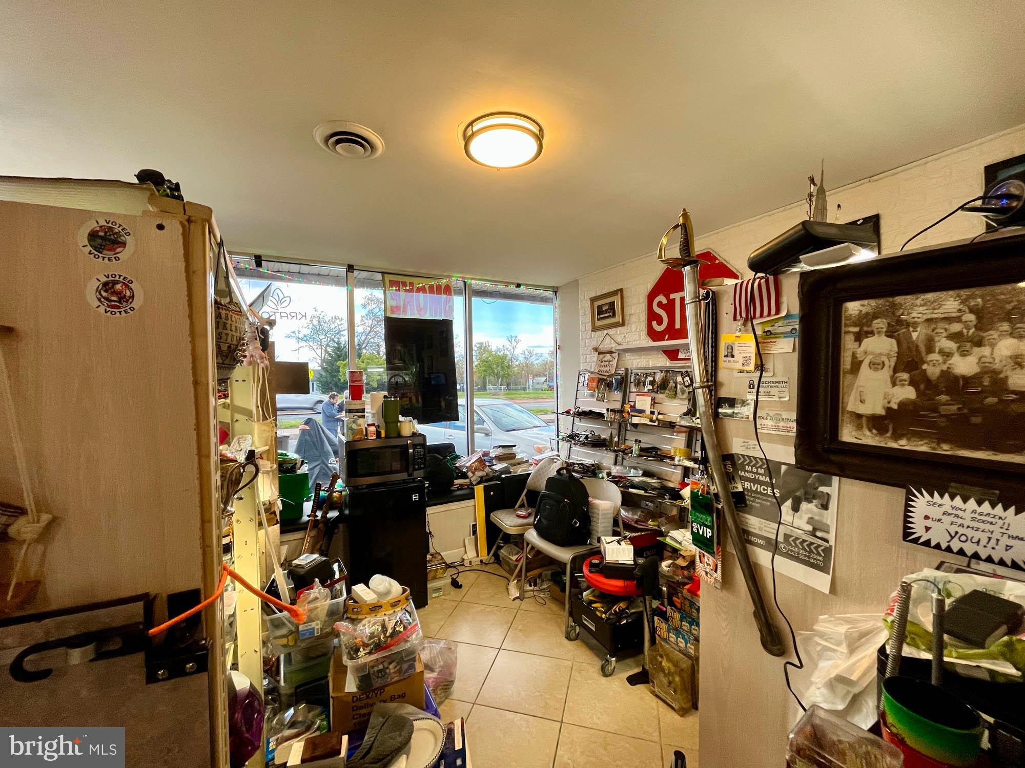 1727 Earhart Road Baltimore, MD 21221 - Photo 41 of 48 a room with gym equipment and a flat screen tv