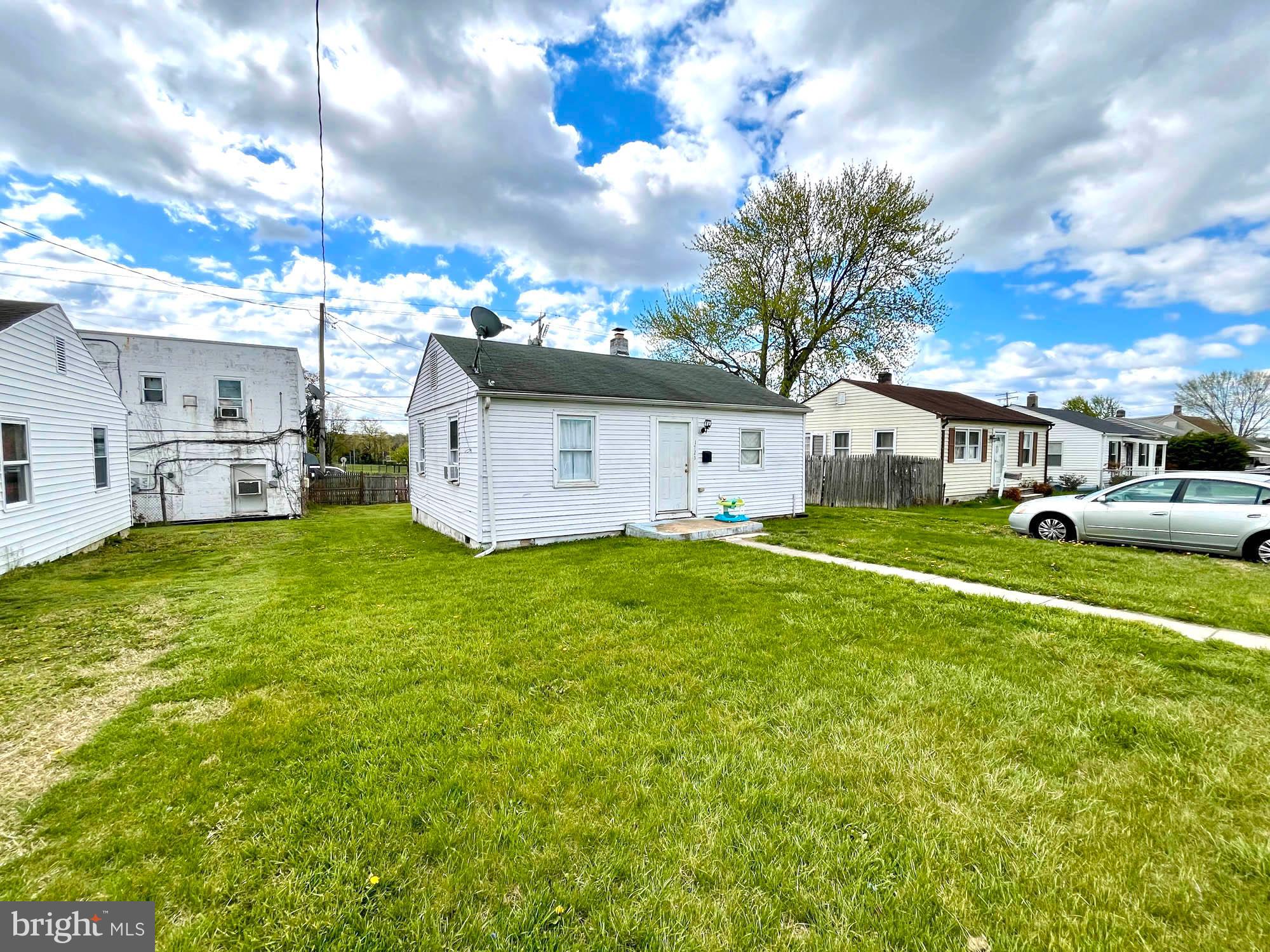 1727 Earhart Road Baltimore, MD 21221 - Photo 5 of 48 a front view of a house with garden