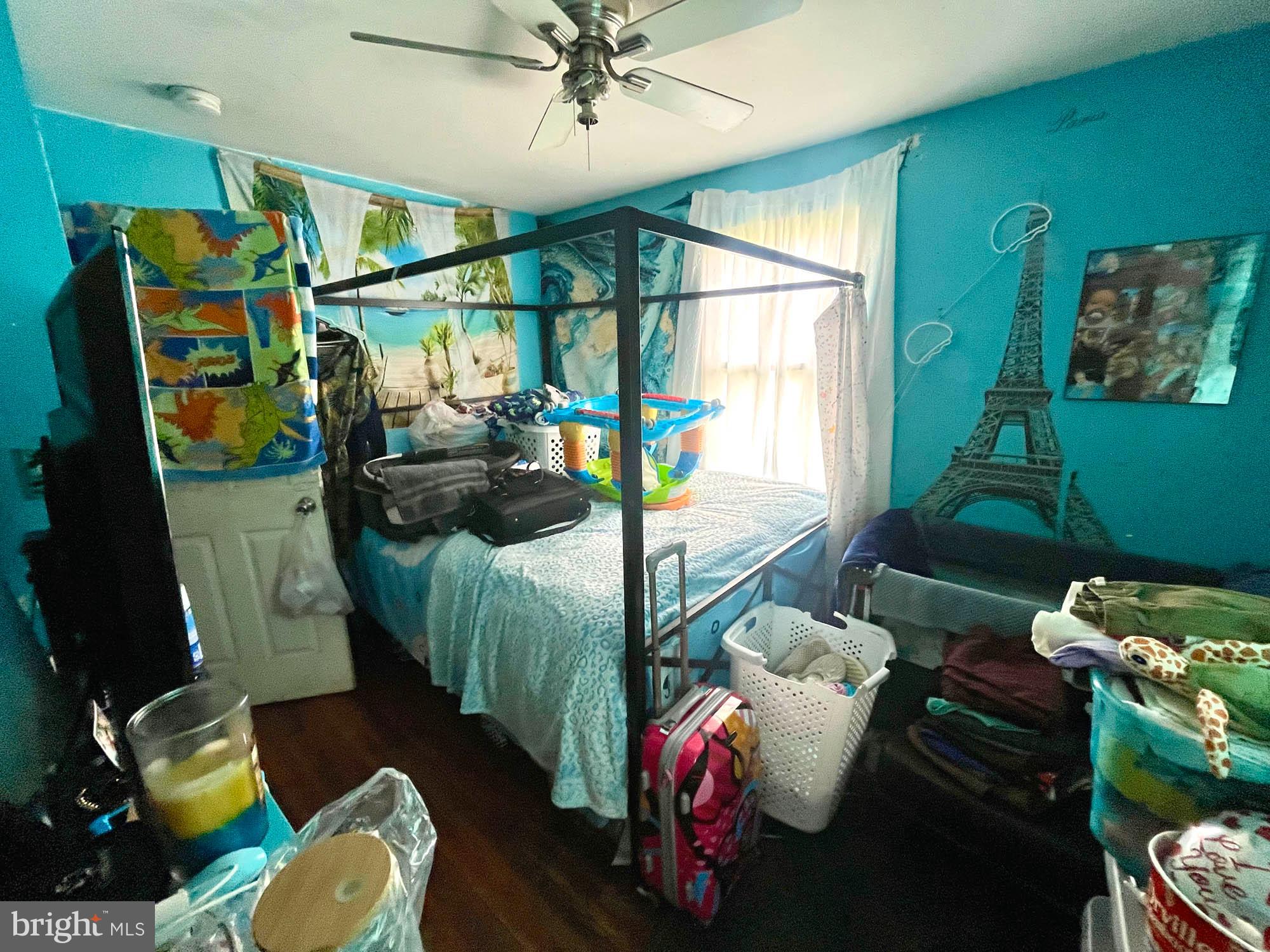 1727 Earhart Road Baltimore, MD 21221 - Photo 7 of 48 a bedroom with furniture and a window